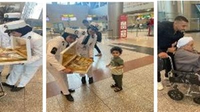 شرطة مطار القاهرة تحتفل بذكرى المولد النبوي الشريف مع المسافرين