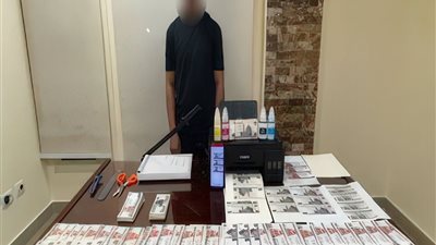 ضبط فني تحاليل بتهمة تقليد العملات المحلية في الجيزة